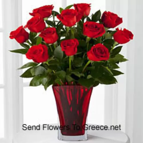11 Rose Rosse con alcune Felci in un Vaso